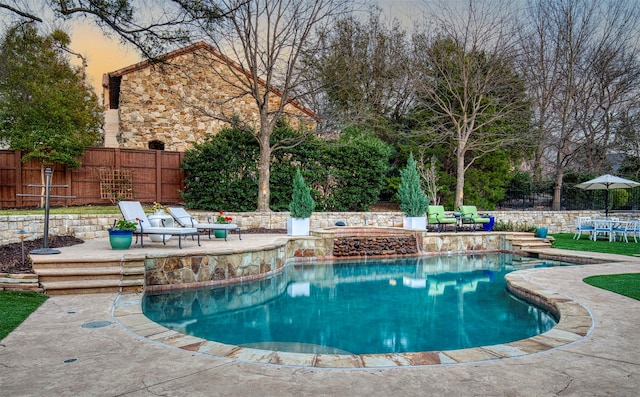 view of swimming pool featuring a fenced in pool, a patio area, and fence