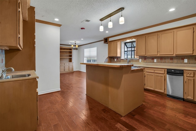 kitchen featuring dark wood finished floors, decorative backsplash, ornamental molding, a sink, and a textured ceiling