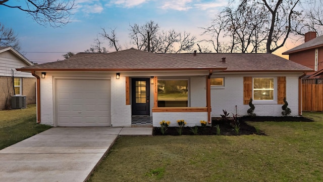 ranch-style house featuring driveway, roof with shingles, and brick siding