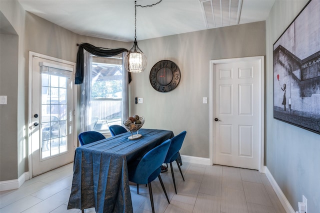 dining room featuring baseboards