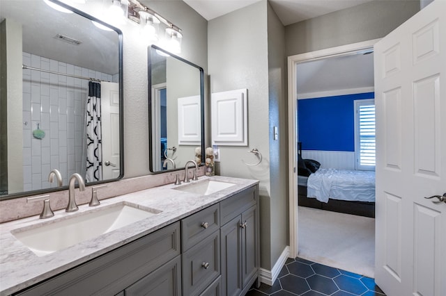 full bath with a sink, visible vents, ensuite bathroom, and double vanity