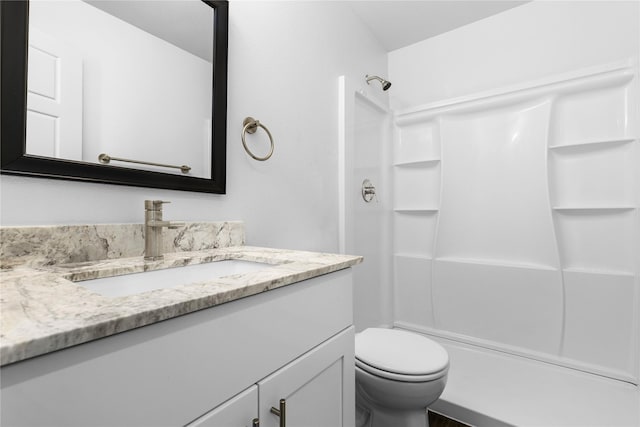 full bath with toilet, walk in shower, and vanity