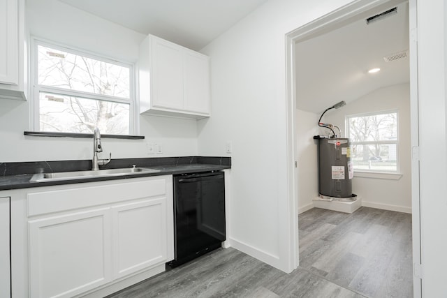 kitchen featuring black dishwasher, visible vents, dark countertops, water heater, and a sink