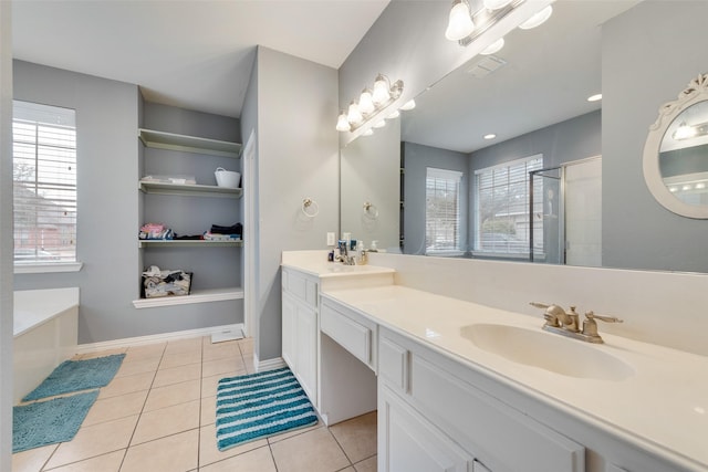 bathroom featuring double vanity, visible vents, a stall shower, a sink, and tile patterned flooring