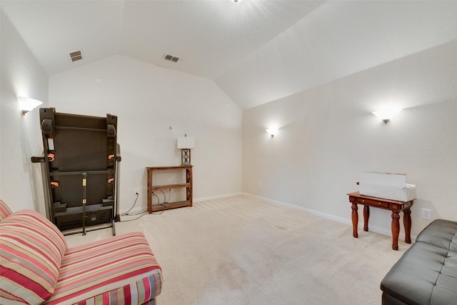 living area with vaulted ceiling, carpet floors, and visible vents