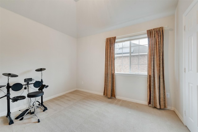 interior space featuring carpet and baseboards