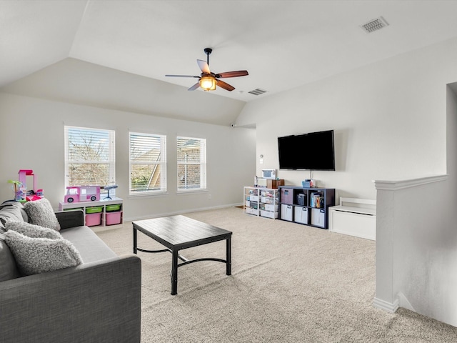 carpeted living room with visible vents, lofted ceiling, baseboards, and ceiling fan