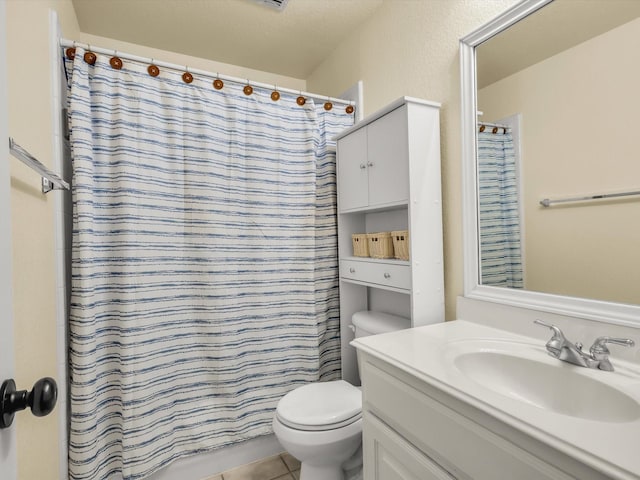 bathroom featuring vanity, toilet, a shower with curtain, and tile patterned flooring