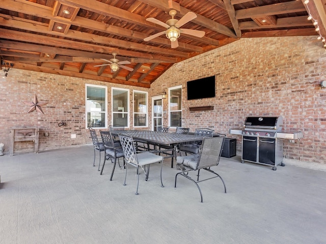 view of patio / terrace featuring grilling area, outdoor dining area, and ceiling fan