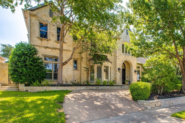5340 Jessica Ln, Frisco, TX 75034 - view of front of property with stone siding and a front lawn