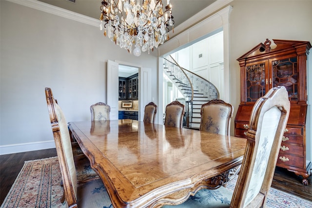 5340 Jessica Ln, Frisco, TX 75034 - dining space featuring a chandelier, dark wood-style flooring, ornamental molding, and stairway