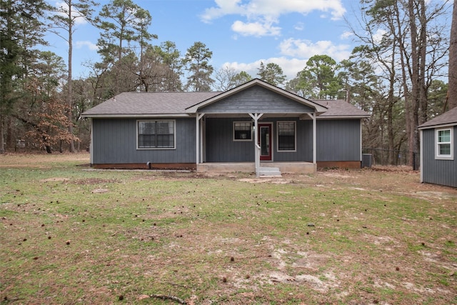 view of front of house with a porch and a front yard