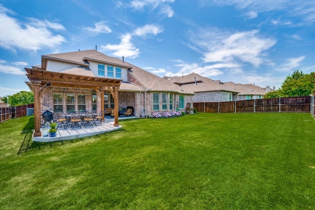 back of house featuring a fenced backyard, brick siding, a yard, a pergola, and a patio area