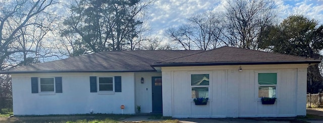 ranch-style house with a shingled roof