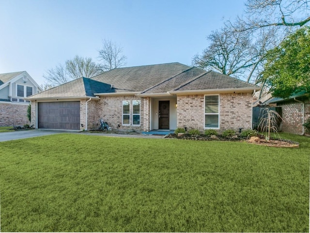 ranch-style house with brick siding, a front yard, roof with shingles, a garage, and driveway