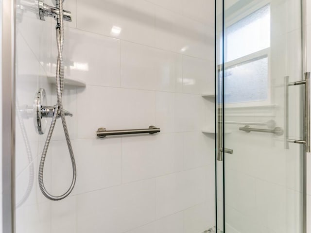 full bathroom featuring a shower stall