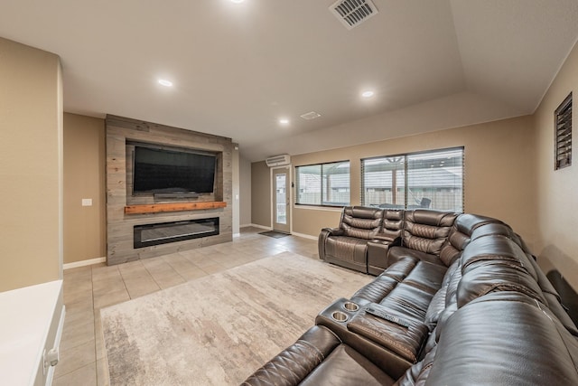 living area featuring light tile patterned floors, baseboards, visible vents, a fireplace, and recessed lighting