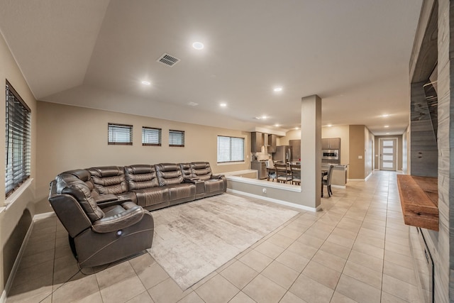 living room with recessed lighting, visible vents, baseboards, and light tile patterned floors