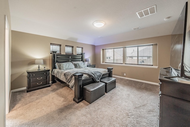 carpeted bedroom featuring visible vents and baseboards