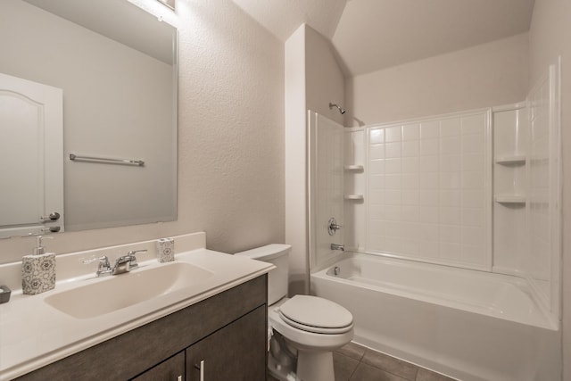 full bath featuring a textured wall, toilet, vanity, shower / tub combination, and tile patterned floors