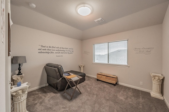 sitting room with carpet floors, visible vents, and baseboards