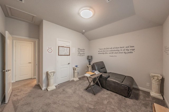 sitting room featuring baseboards, vaulted ceiling, and carpet flooring