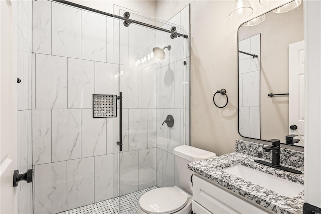 full bathroom with toilet, a textured wall, a shower stall, and vanity