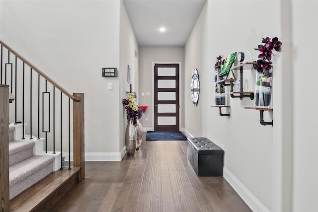 entrance foyer featuring stairs, baseboards, wood finished floors, and recessed lighting