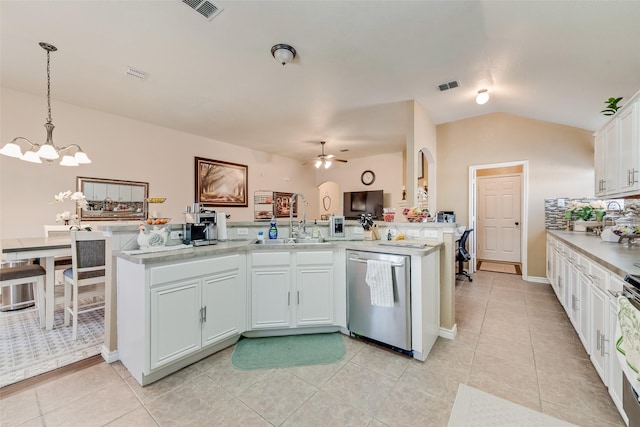 kitchen with a sink, visible vents, stainless steel dishwasher, and lofted ceiling