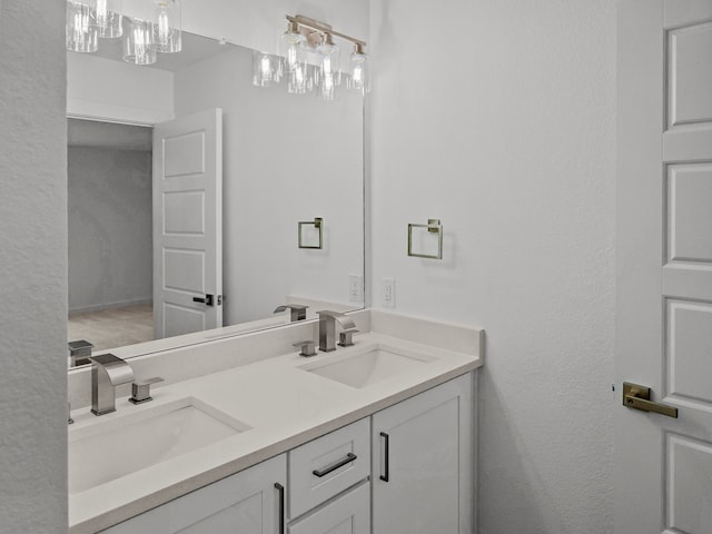 full bathroom with a sink and double vanity