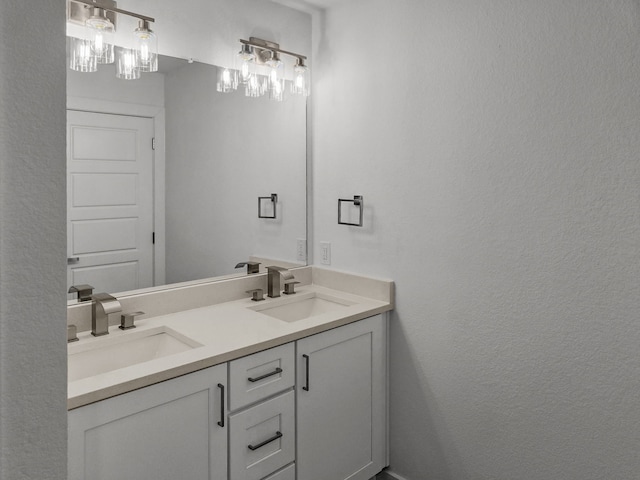 bathroom with double vanity and a sink