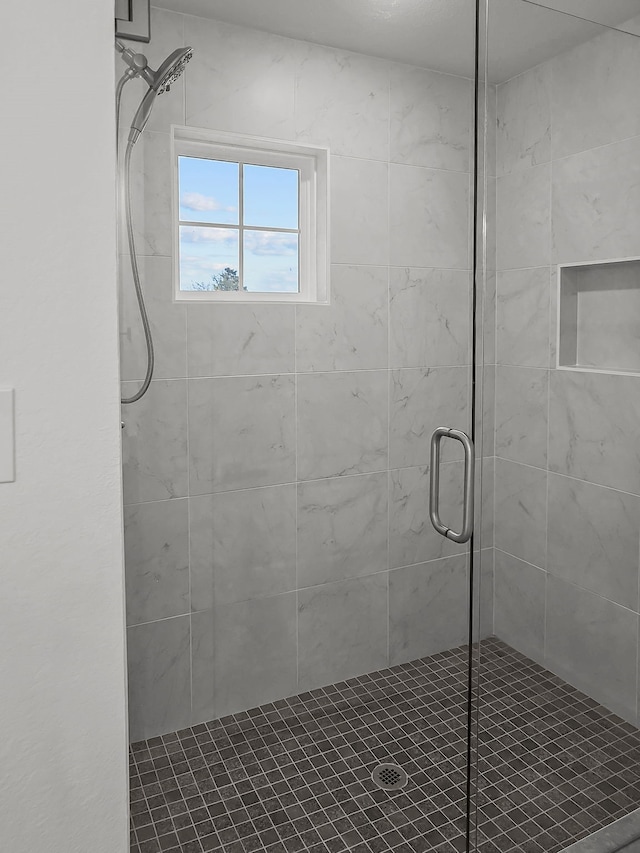 bathroom featuring a shower stall