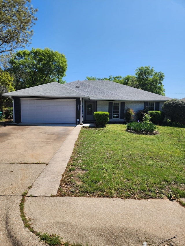 ranch-style house with a front yard, roof with shingles, driveway, and an attached garage