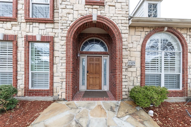 entrance to property with stone siding