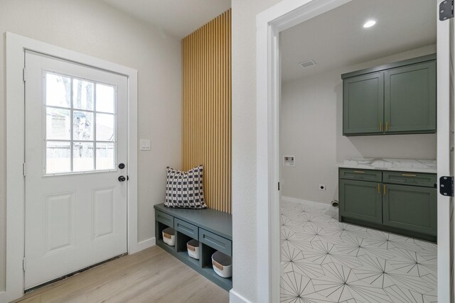 mudroom with recessed lighting, visible vents, and baseboards