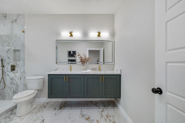 bathroom featuring a marble finish shower, a sink, toilet, and double vanity