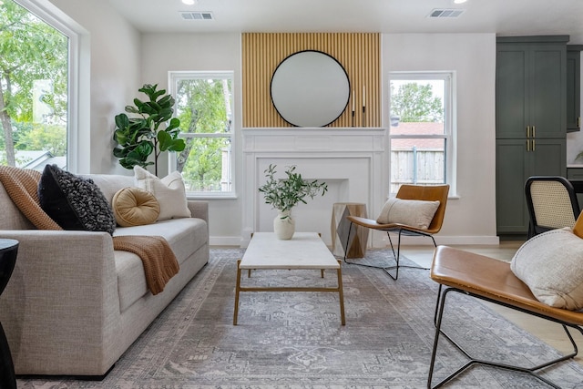 sitting room featuring visible vents and baseboards