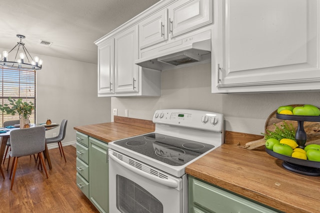 kitchen featuring visible vents, white range with electric cooktop, under cabinet range hood, wood counters, and green cabinets