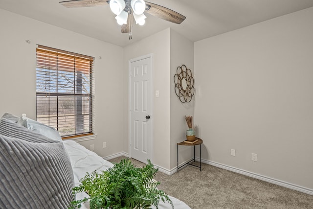 bedroom featuring baseboards, carpet, and a ceiling fan