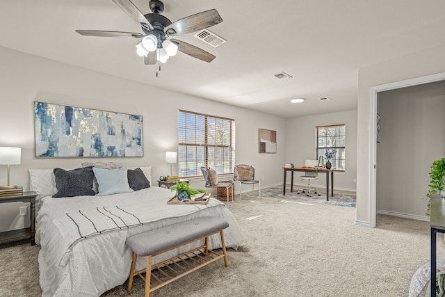 bedroom featuring multiple windows, baseboards, visible vents, and carpet floors