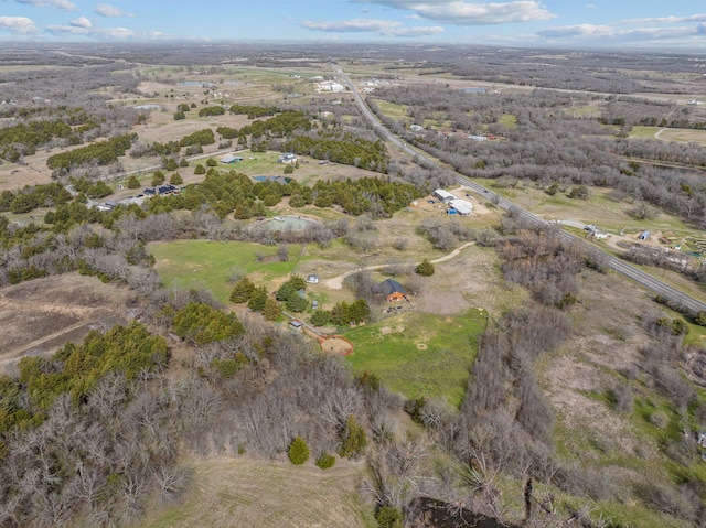 birds eye view of property with a rural view