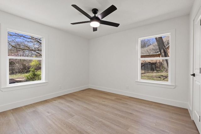 300 Covey Ln, Mckinney, TX 75071 - unfurnished room with a wealth of natural light, light wood finished floors, and baseboards