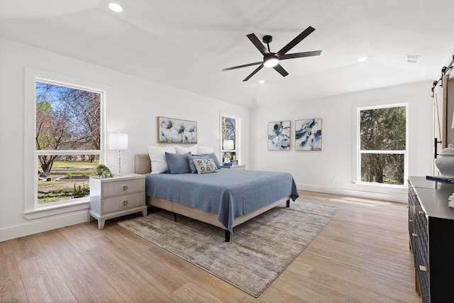 300 Covey Ln, Mckinney, TX 75071 - bedroom featuring a barn door, recessed lighting, visible vents, and light wood-type flooring