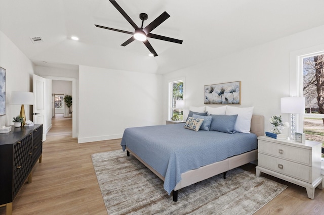 300 Covey Ln, Mckinney, TX 75071 - bedroom featuring light wood-style flooring, multiple windows, and visible vents