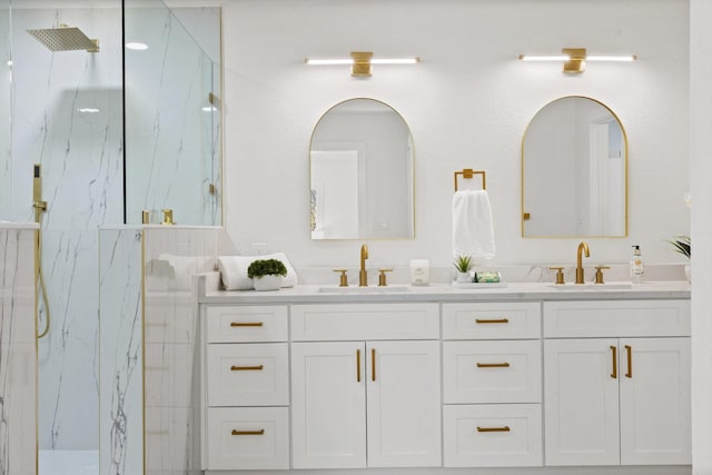 300 Covey Ln, Mckinney, TX 75071 - bathroom featuring a sink, a marble finish shower, and double vanity
