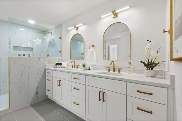 300 Covey Ln, Mckinney, TX 75071 - full bathroom featuring tile patterned floors, a marble finish shower, double vanity, and a sink