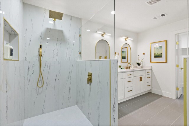 300 Covey Ln, Mckinney, TX 75071 - bathroom featuring vanity, visible vents, a marble finish shower, baseboards, and tile patterned flooring