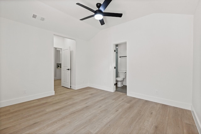 300 Covey Ln, Mckinney, TX 75071 - unfurnished bedroom with baseboards, visible vents, lofted ceiling, ensuite bathroom, and light wood-type flooring