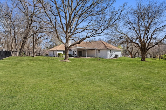 300 Covey Ln, Mckinney, TX 75071 - view of yard featuring an attached garage and fence