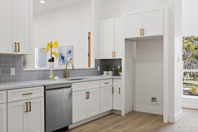 300 Covey Ln, Mckinney, TX 75071 - kitchen featuring stainless steel dishwasher, light wood-style floors, plenty of natural light, white cabinets, and a sink